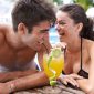couple drinking by pool
